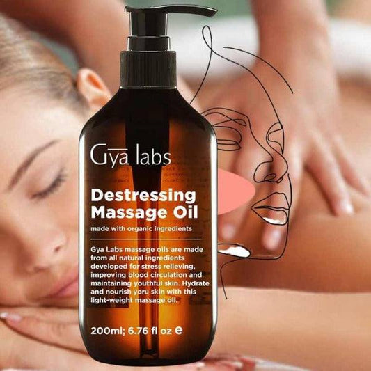 a woman getting a massage with a bottle of massage oil