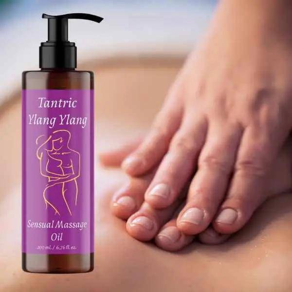 a bottle of lavender massage oil being held by a woman