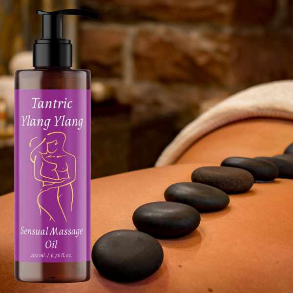 a bottle of massage oil sitting on a woman's back