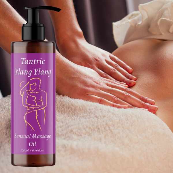 a woman getting a massage with a bottle of lavender massage oil