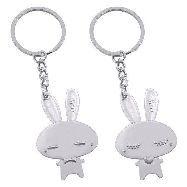 a couple of key chains with a cartoon character on it