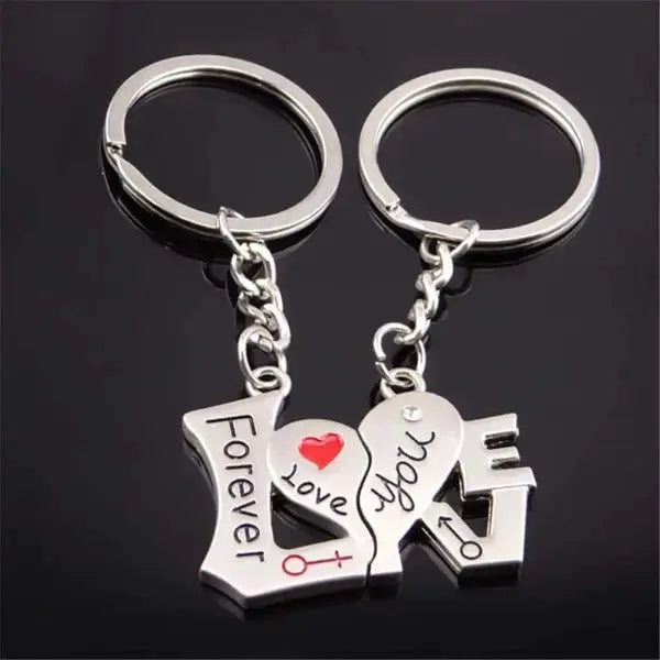 a couple of key chains with a heart on it