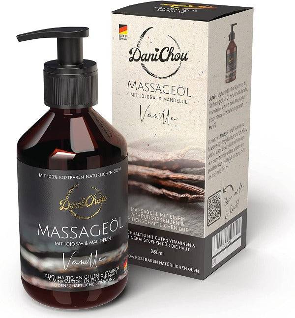 a bottle of massage oil next to a box