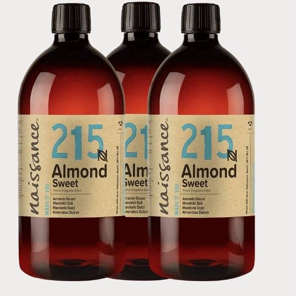 three bottles of almond sweet syrup on a white background